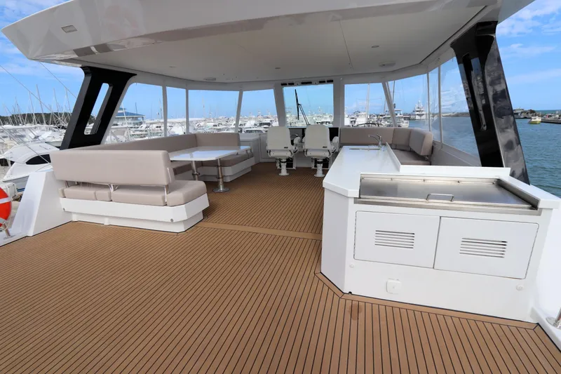 Slide: The Image of Spacious deck of 2025 Two Oceans 55 yacht with seating and kitchenette. - 37