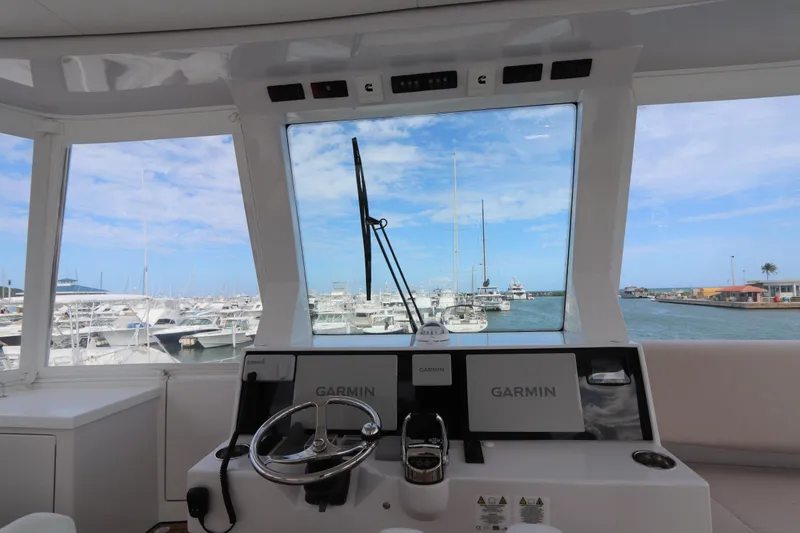 Slide: The Image of Interior view of 2025 Two Oceans 55 yacht cockpit with marina in background. - 40