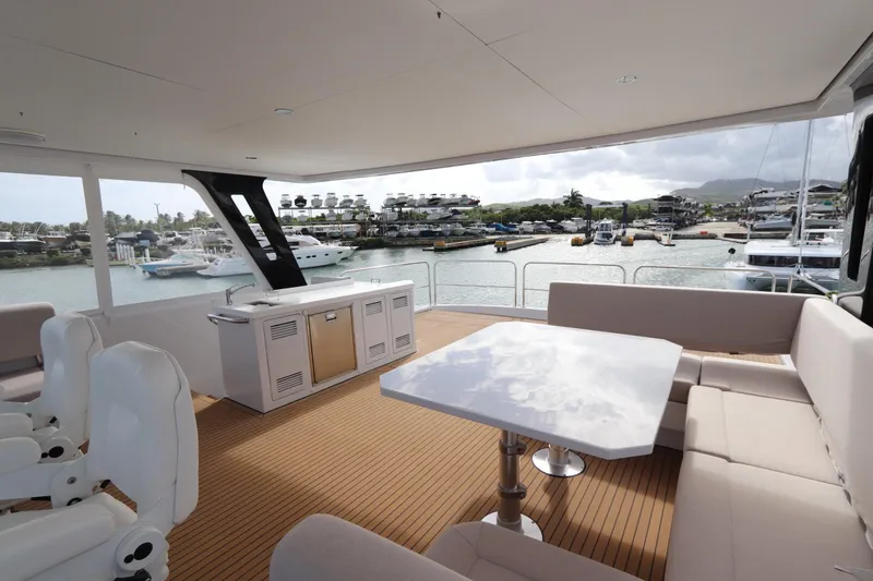 Slide: The Image of Luxurious 2025 Two Oceans 55 yacht interior with elegant seating and scenic marina view. - 42
