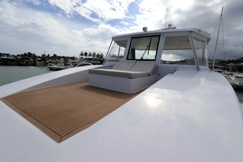 Slide: The Image of Luxury Two Oceans 55 yacht, 2025 model, docked in a marina under a partly cloudy sky. - 46