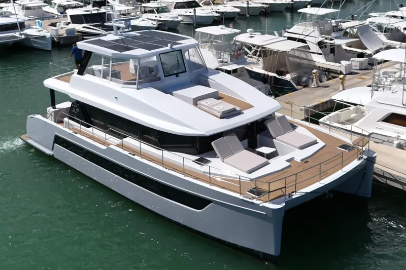 Slide: The Image of Luxurious 2025 Two Oceans 55 yacht docked in a marina, showcasing sleek design and spacious deck. - 54