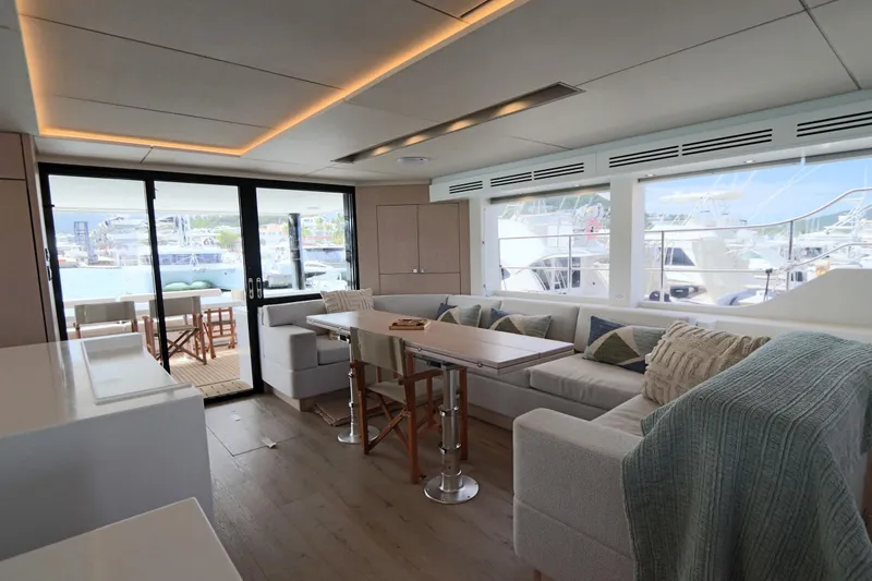 Slide: The Image of Luxurious interior of 2025 Two Oceans 55 yacht with modern seating and large windows. - 7