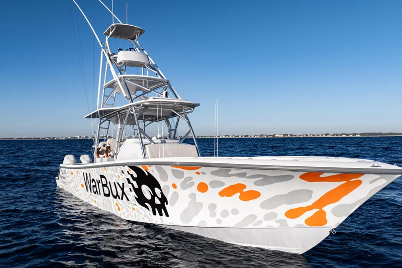 Slide: The Image of 2026 SeaVee 420Z boat on open water, featuring multiple outboard engines. - 11