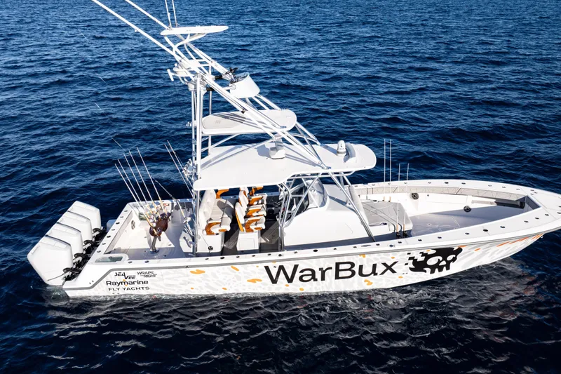 Slide: The Image of 2026 SeaVee 420Z boat on water, featuring "WarBux" design and fishing equipment. - 12