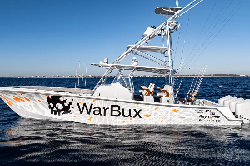 Slide: The Image of 2026 SeaVee 420Z boat on open ocean, showcasing sleek design and spacious deck. - 13