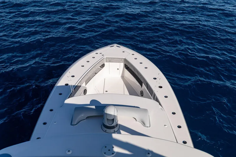 Slide: The Image of 2026 SeaVee 420Z boat helm with navigation display on open ocean. - 15