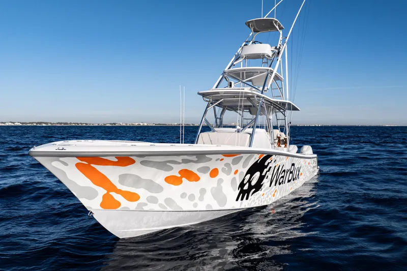 Slide: The Image of 2026 SeaVee 420Z boat with custom graphics on open water. - 2