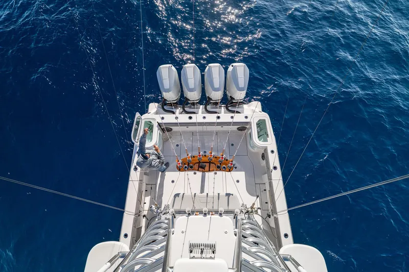 Slide: The Image of Aerial view of 2026 SeaVee 420Z boat with four engines on blue ocean. - 21