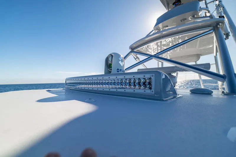 Slide: The Image of 2026 SeaVee 420Z fishing boat with multiple rods, ocean view, and powerful engines. - 25