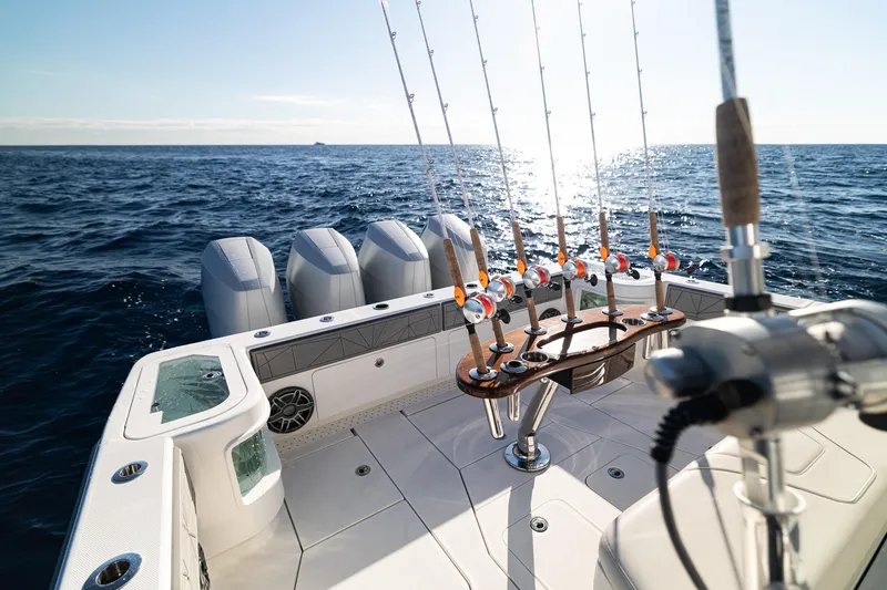 Slide: The Image of 2026 SeaVee 420Z fishing boat with multiple rods, ocean view, and powerful engines. - 26