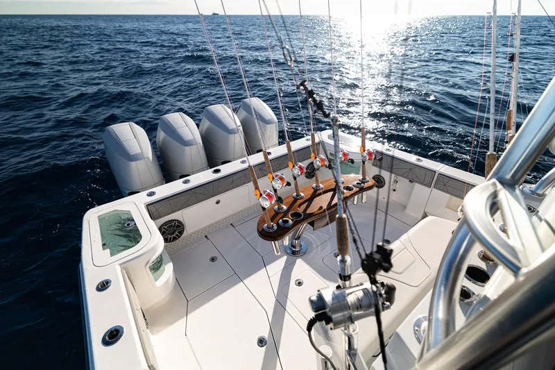 Slide: The Image of 2026 SeaVee 420Z fishing boat with multiple rods, ocean view, and powerful engines. - 27