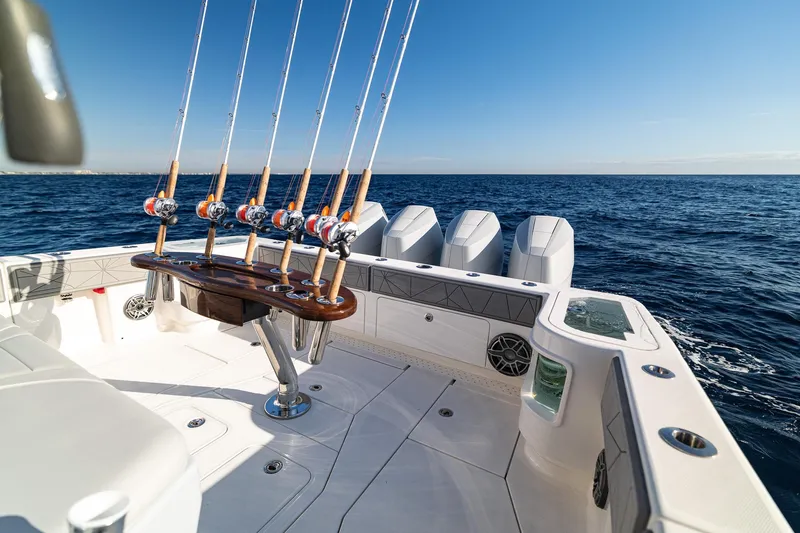 Slide: The Image of 2026 SeaVee 420Z fishing boat with rods, ocean view, and clear sky. - 31