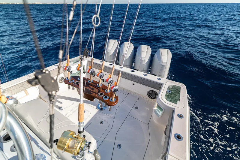 Slide: The Image of 2026 SeaVee 420Z fishing boat with multiple rods and powerful engines on open water. - 33