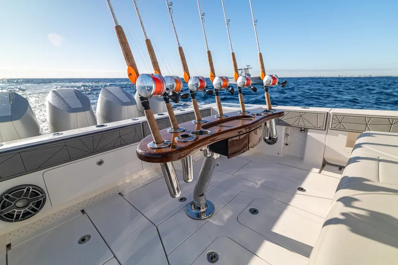 Slide: The Image of Sleek 2026 SeaVee 420Z boat with powerful engines cruising on open ocean. - 36