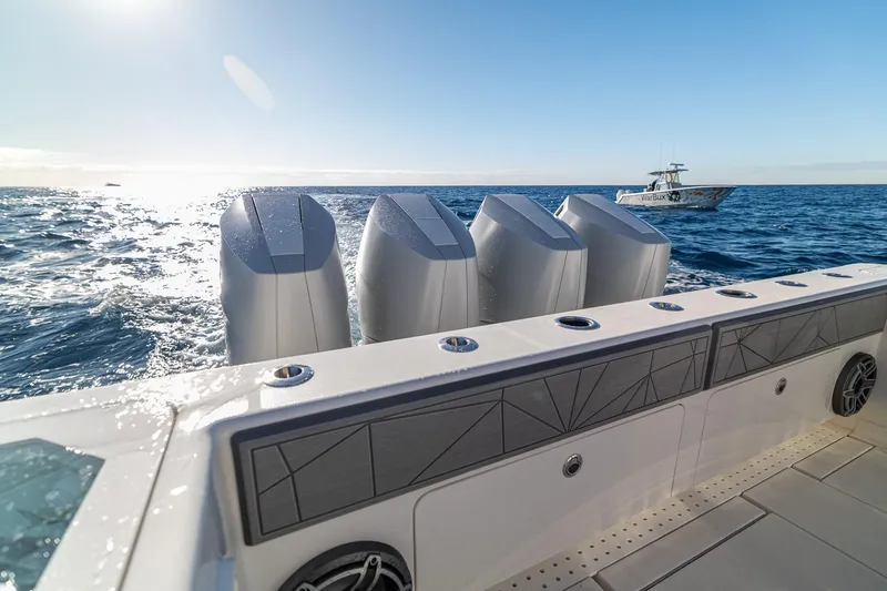Slide: The Image of 2026 SeaVee 420Z boat with four powerful engines cruising on open sea. - 37