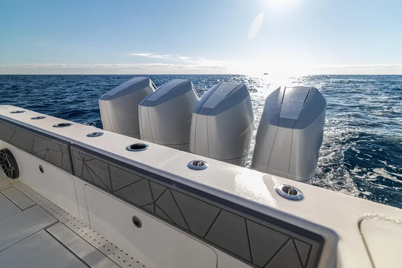 Slide: The Image of 2026 SeaVee 420Z boat with four powerful engines cruising on open sea. - 38