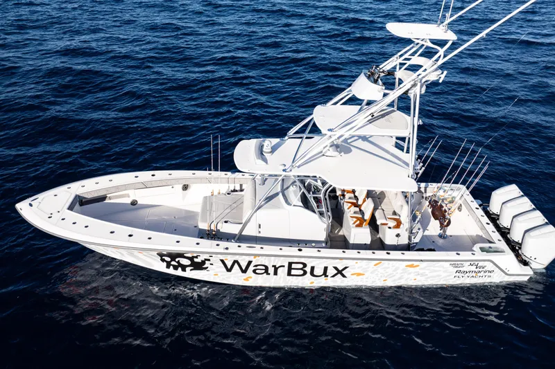 Slide: The Image of 2026 SeaVee 420Z boat on open water, featuring multiple fishing rods and powerful engines. - 4