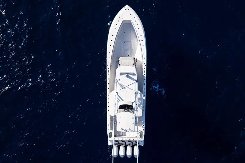 Slide: The Image of Aerial view of 2026 SeaVee 420Z boat on deep blue ocean water. - 7