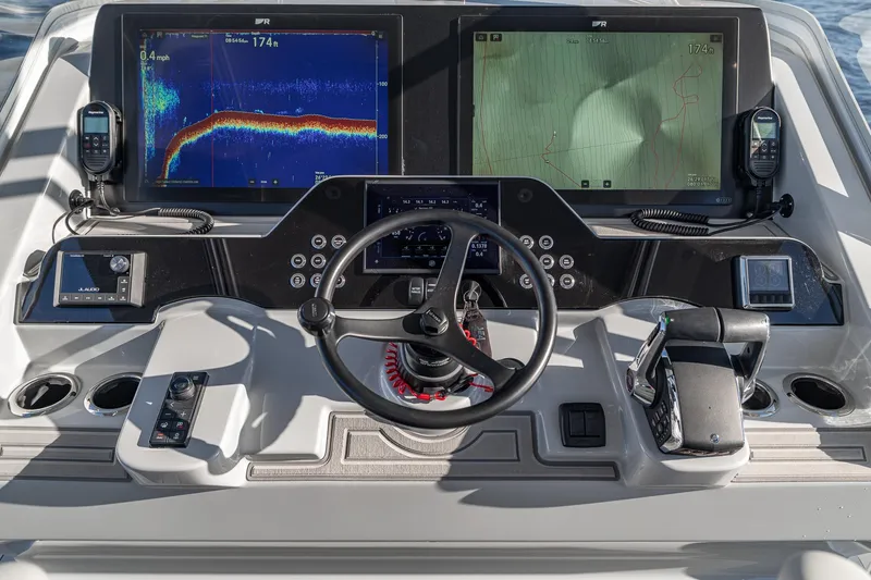 Slide: The Image of 2026 SeaVee 420Z boat dashboard with advanced navigation and control systems. - 74