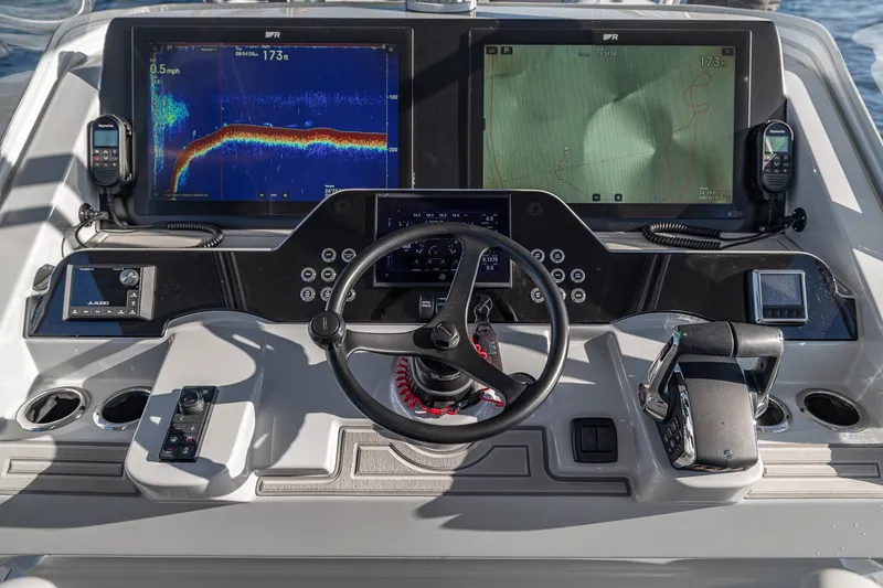 Slide: The Image of Helm of 2026 SeaVee 420Z boat with advanced navigation and control systems. - 75