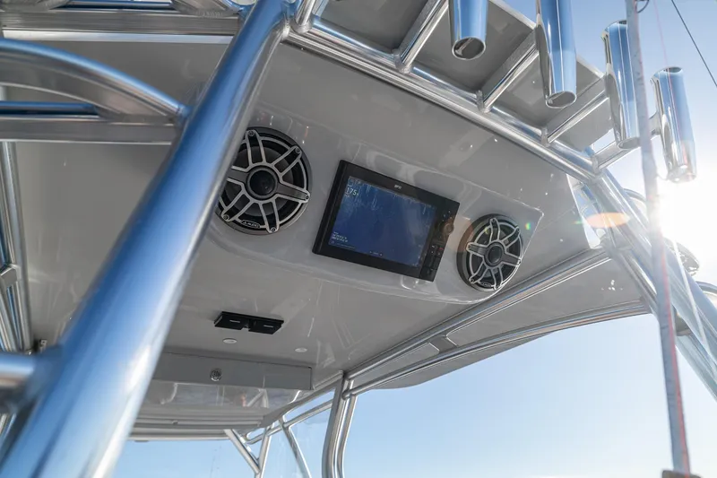 Slide: The Image of 2026 SeaVee 420Z boat tower with speakers and navigation screen against clear sky. - 79