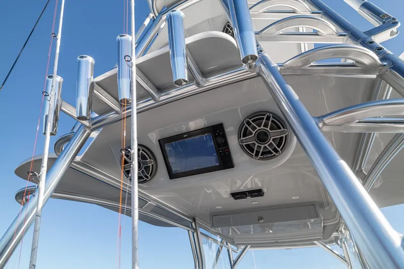 Slide: The Image of 2026 SeaVee 420Z boat tower with speakers and navigation screen against clear sky. - 80