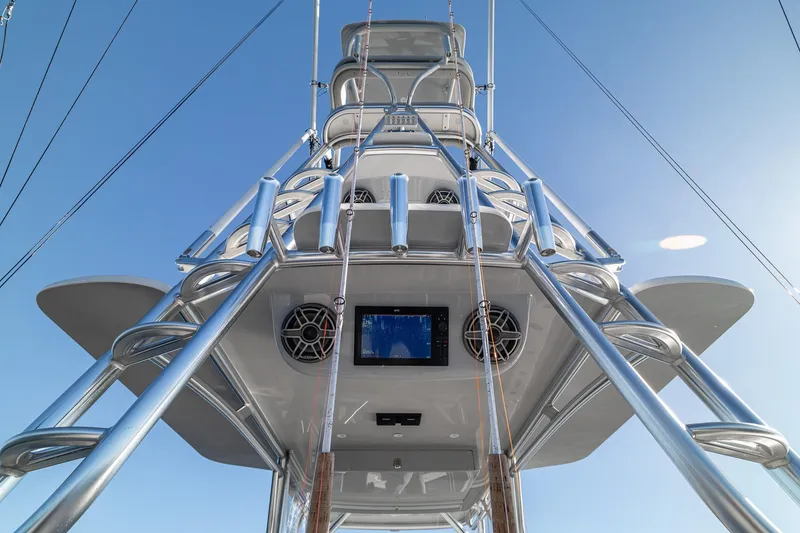Slide: The Image of 2026 SeaVee 420Z boat tower with speakers and navigation screen against blue sky. - 81