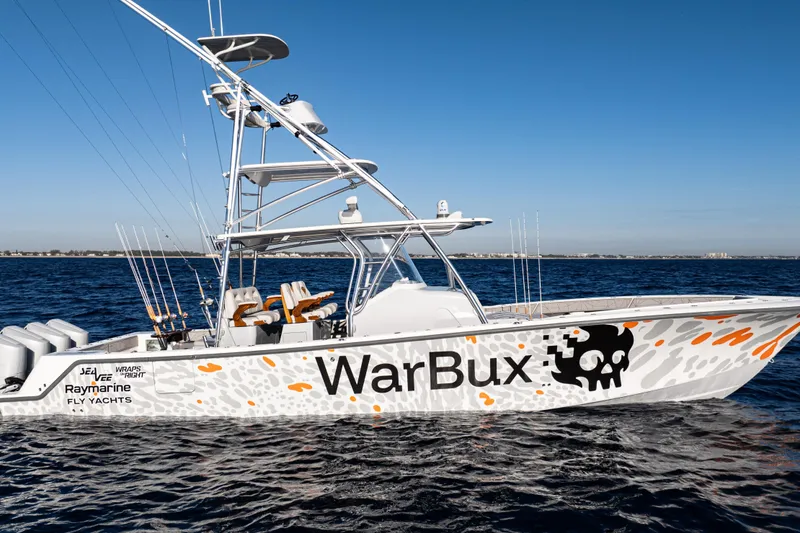 Slide: The Image of 2026 SeaVee 420Z boat with four engines on open water, clear blue sky. - 9