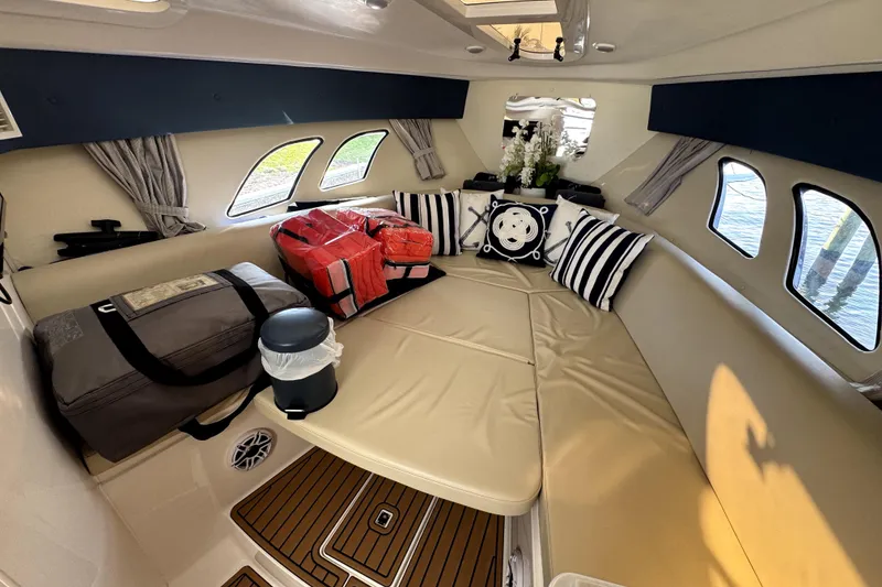 Slide: The Image of Open cooler with drinks on 2014 Intrepid 400 Cuddy boat deck. - 18