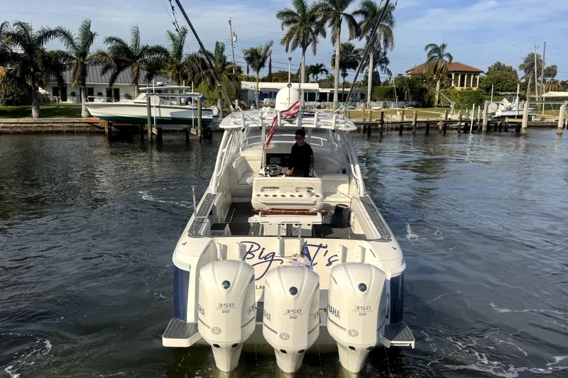 Slide: The Image of 2014 Intrepid 400 Cuddy boat on blue water, clear sky background. - 2