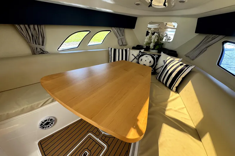Slide: The Image of Interior of 2014 Intrepid 400 Cuddy with cozy seating and elegant decor. - 21