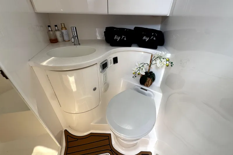Slide: The Image of Luxurious bathroom in 2014 Intrepid 400 Cuddy boat with modern fixtures and decor. - 25