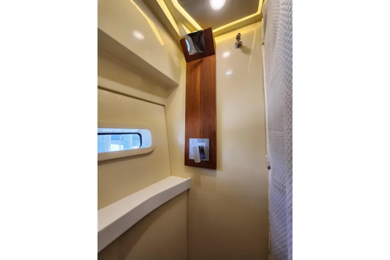 Slide: The Image of 2020 Regal 38 XO yacht interior with modern shower and window. - 14