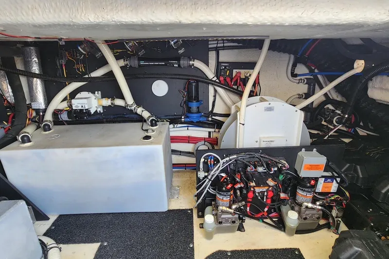 Slide: The Image of Engine room of 2020 Regal 38 XO boat with complex wiring and equipment. - 16