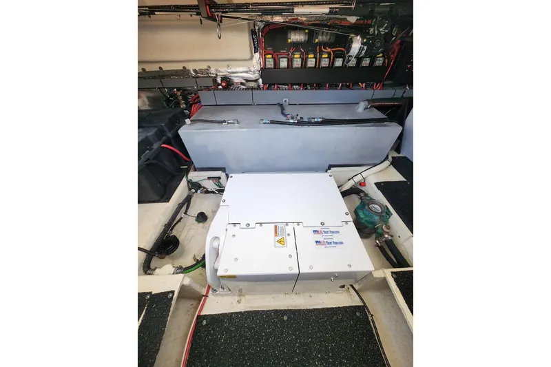 Slide: The Image of Engine compartment of 2020 Regal 38 XO boat, showcasing electrical components and wiring. - 17