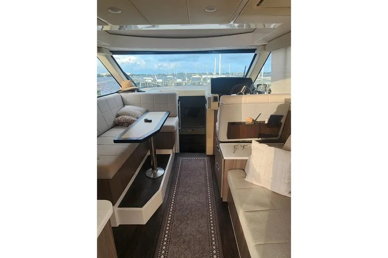 Slide: The Image of Luxurious interior of 2020 Regal 38 XO yacht with elegant seating and scenic view. - 5