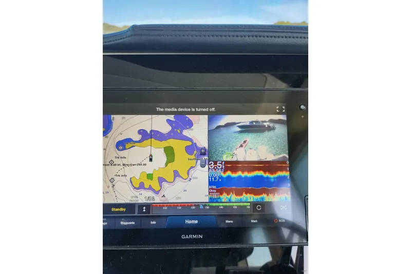 Slide: The Image of Garmin navigation display on 2020 Regal 38 XO boat, showing map and sonar data. - 8