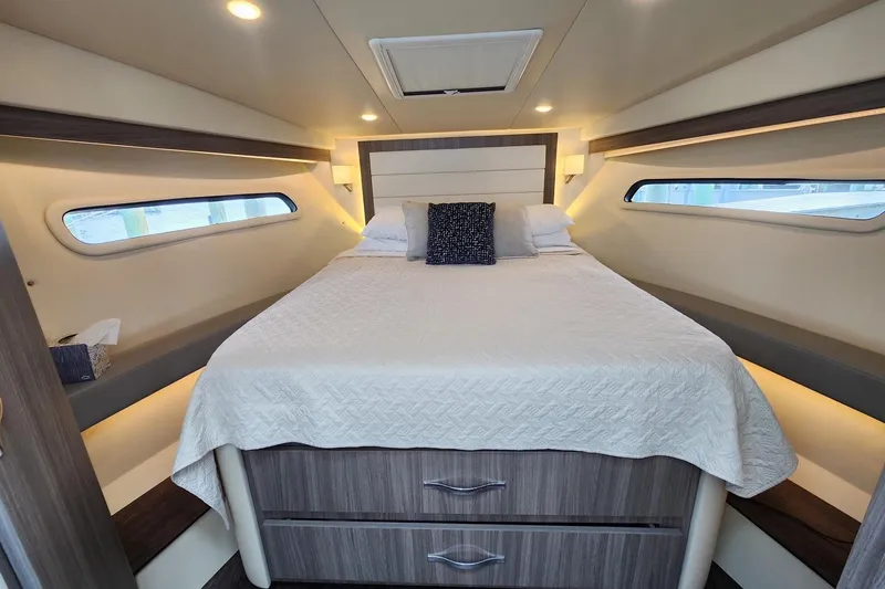 Slide: The Image of Luxurious cabin interior of 2020 Regal 38 XO yacht with cozy bed and modern design. - 9