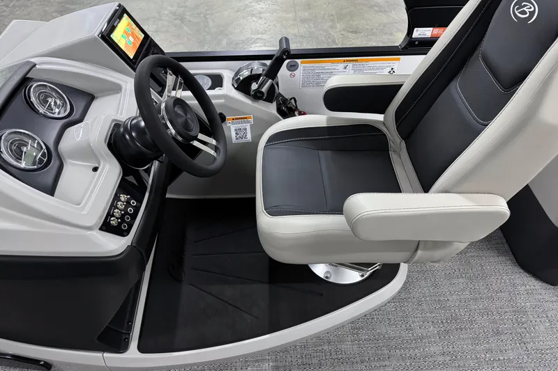 Slide: The Image of 2026 Barletta Cabrio 24M helm with modern controls and comfortable captain's chair. - 25