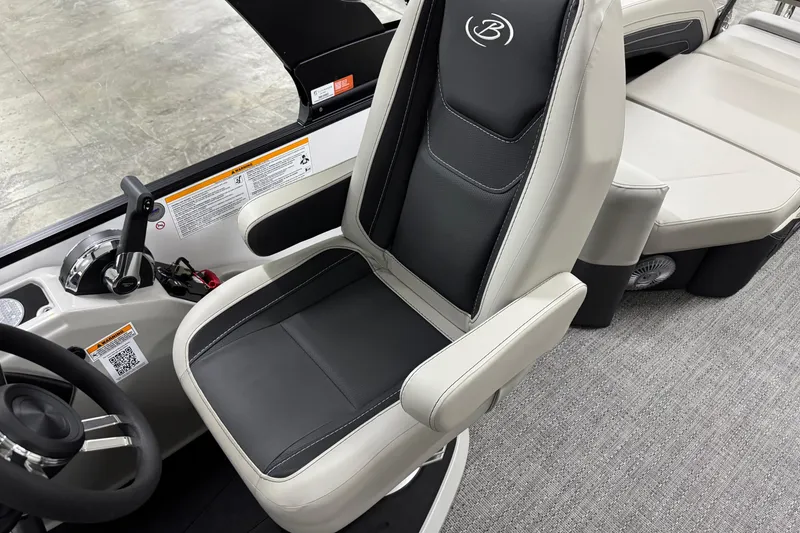 Slide: The Image of 2026 Barletta Cabrio 24M boat interior with sleek captain's chair and control panel. - 26