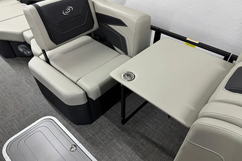 Slide: The Image of 2026 Barletta Cabrio 24M interior seating with foldable table and cup holder. - 32