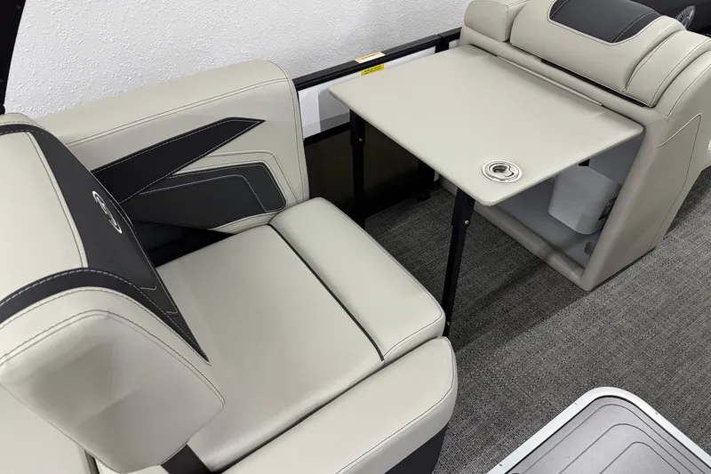 Slide: The Image of 2026 Barletta Cabrio 24M interior with beige seating and foldable table. - 33