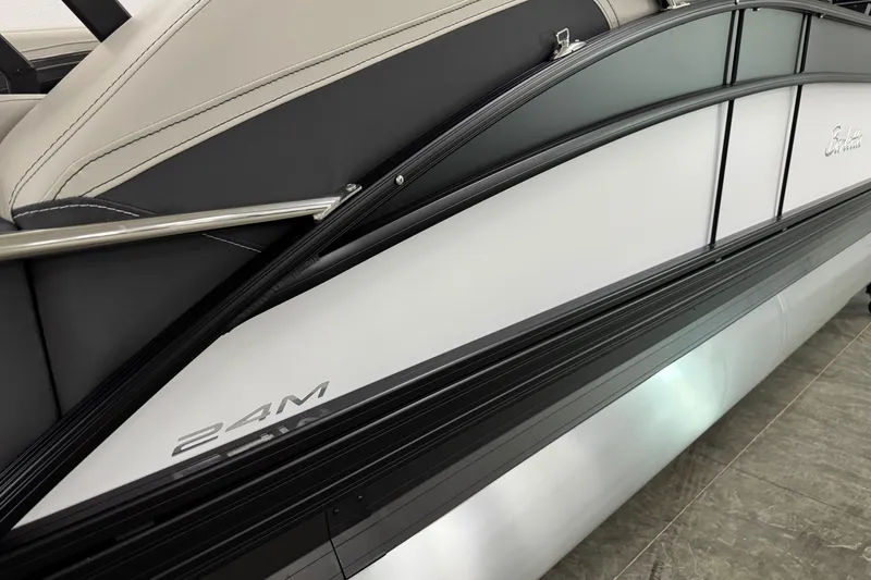 Slide: The Image of 2026 Barletta Cabrio 24M pontoon boat, sleek design with black and white detailing. - 41