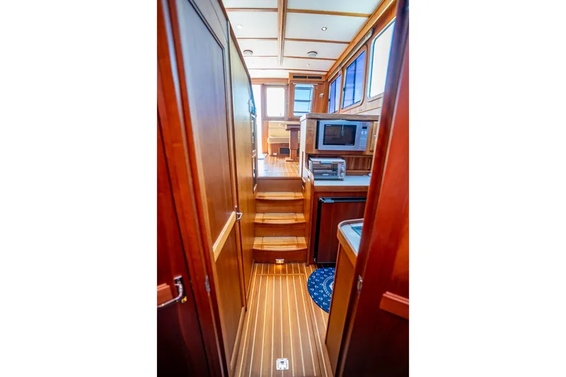 Slide: The Image of Interior of 2006 Sabreline 36 Fly yacht with wooden cabinetry and modern appliances. - 105