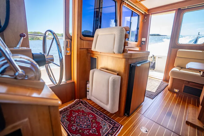 Slide: The Image of Interior of 2006 Sabreline 36 Fly yacht with wooden finishes and nautical decor. - 107