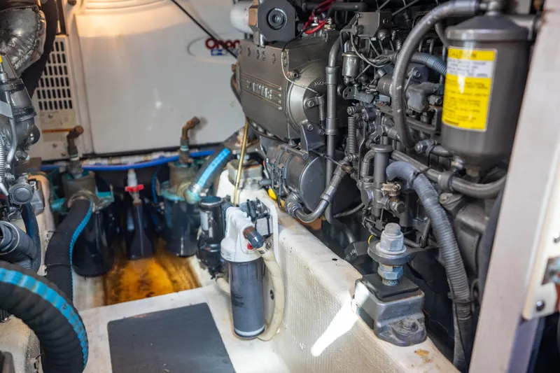 Slide: The Image of Engine room of a 2006 Sabreline 36 Fly, showcasing detailed mechanical components. - 123