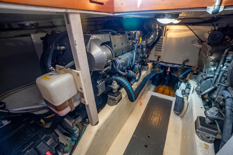 Slide: The Image of Engine room of a 2006 Sabreline 36 Fly, showcasing mechanical components and systems. - 125