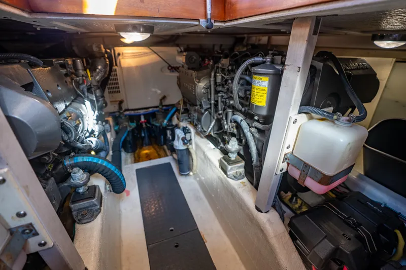 Slide: The Image of Engine room of a 2006 Sabreline 36 Fly, showcasing mechanical components and systems. - 126