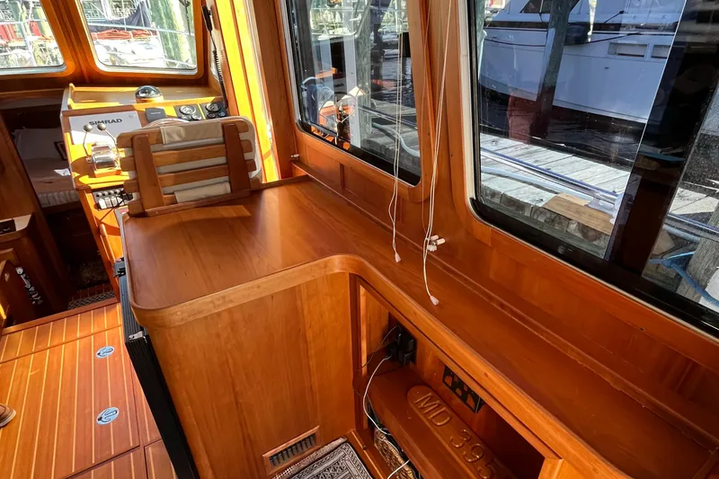 Slide: The Image of Interior of 2006 Sabre 36 Flybridge Sedan with wooden finish and helm station. - 18
