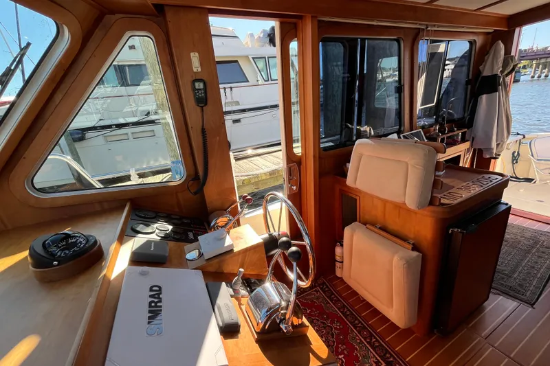 Slide: The Image of Interior view of 2006 Sabre 36 Flybridge Sedan, featuring helm and navigation equipment. - 24